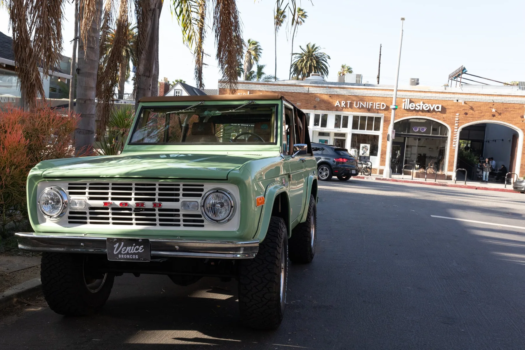 Beach Baby — seafoam green Bronco under the palms