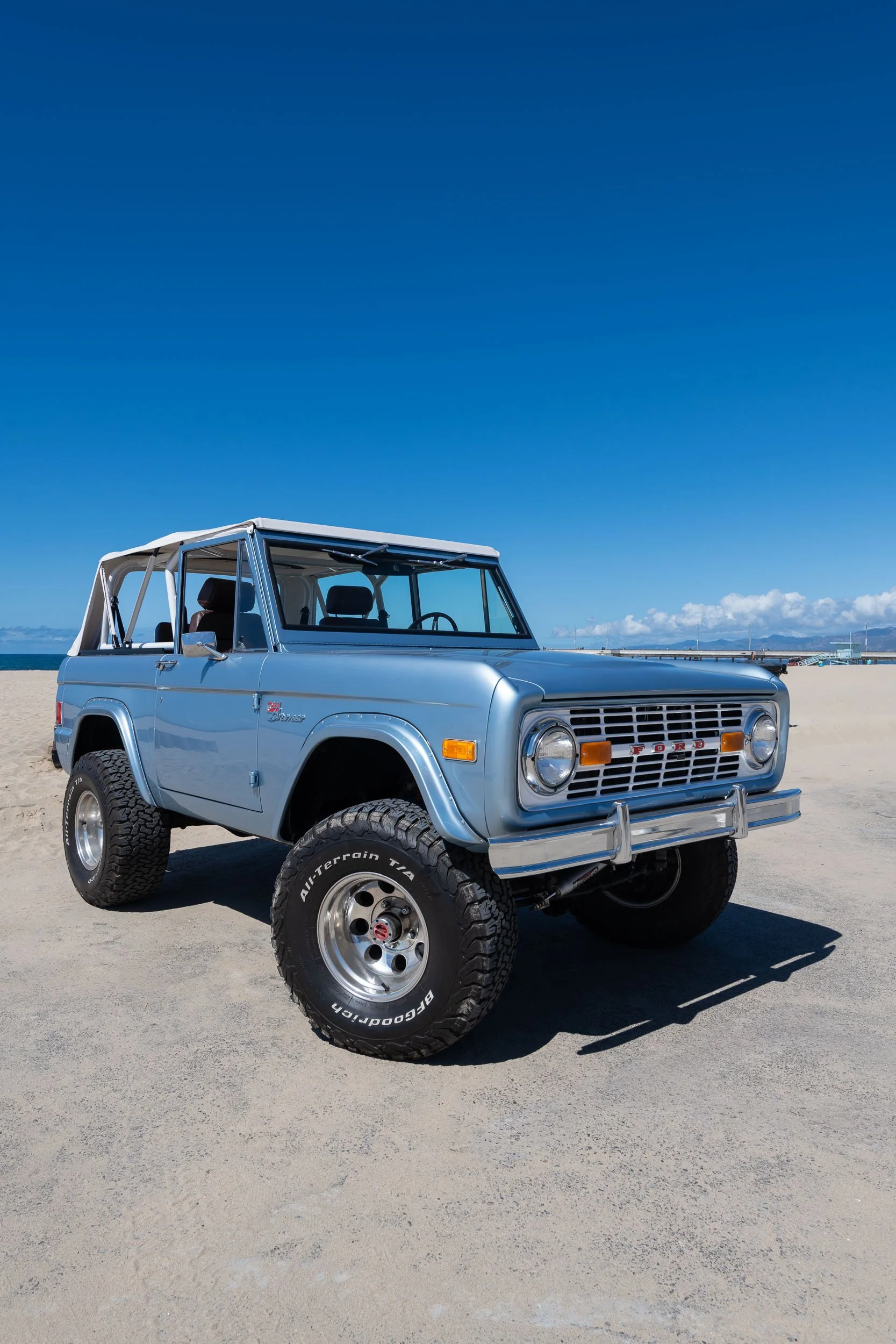 Bella, a restored Brittany Blue early Bronco, photographed by the ocean near Venice Beach