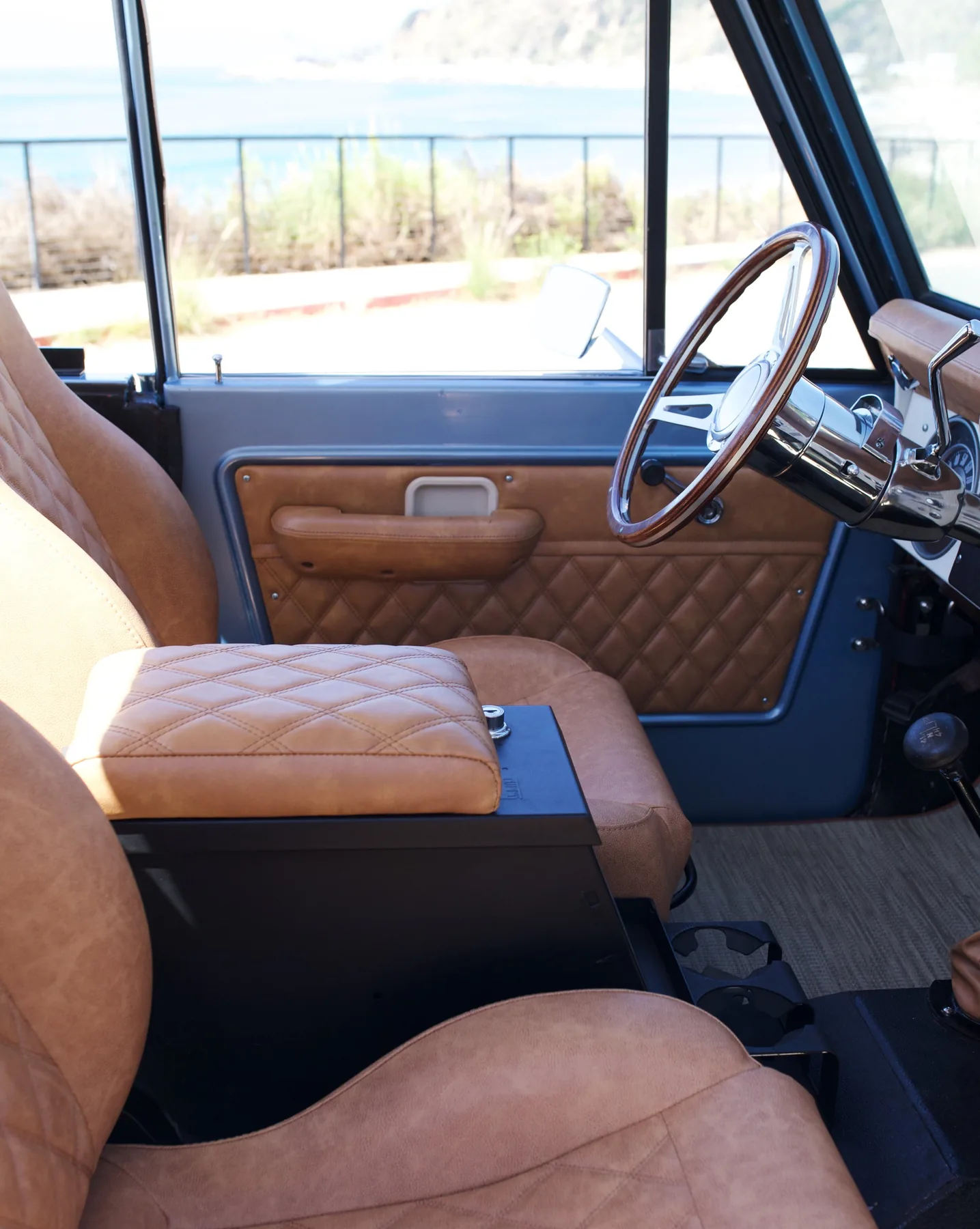 Blue Bronco with quilted saddle console