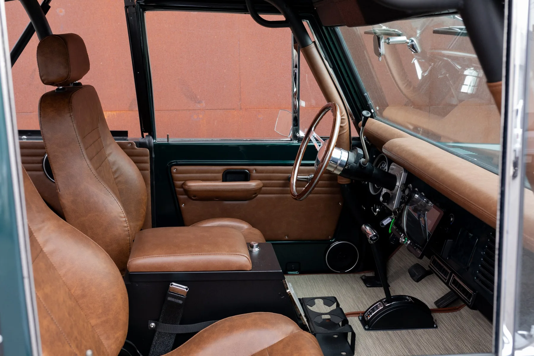 Deep green Bronco with saddle leather interior